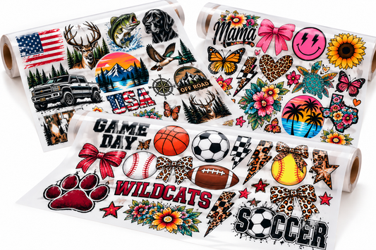 Three finished DTF gang sheets with sports, outdoor, and custom apparel designs on a white studio background